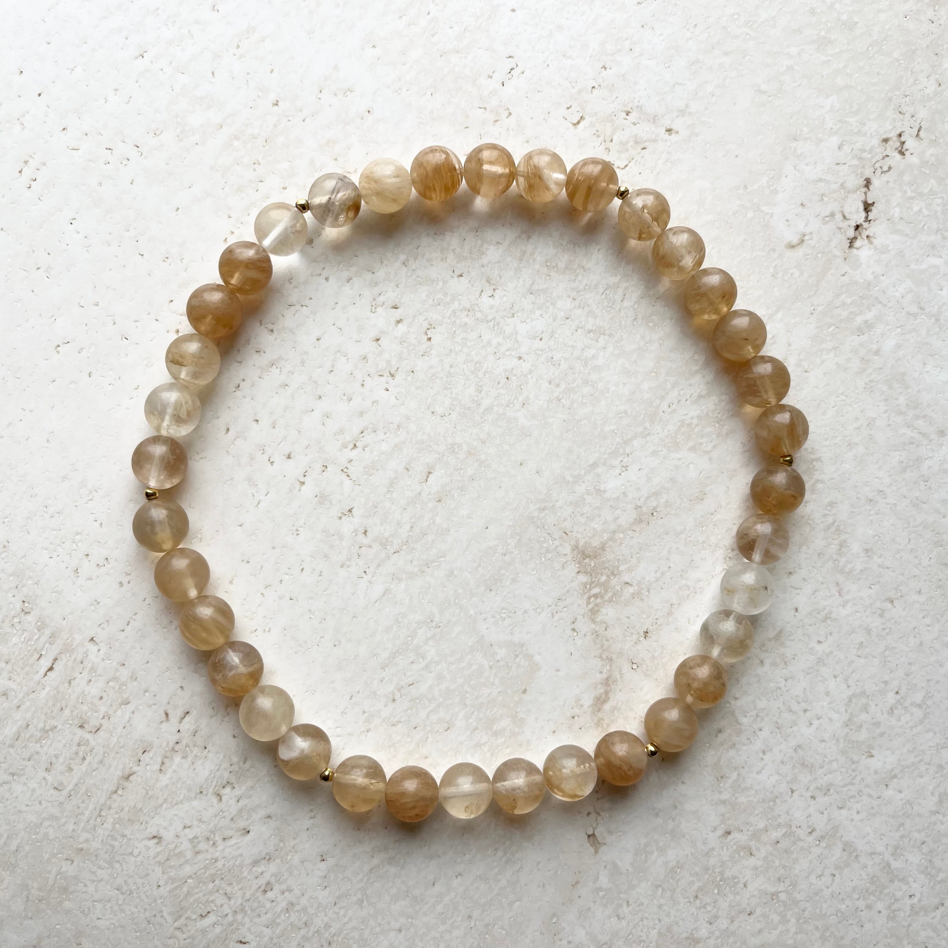 Citrin halskæde med 12 mm perler og 18kt guld.